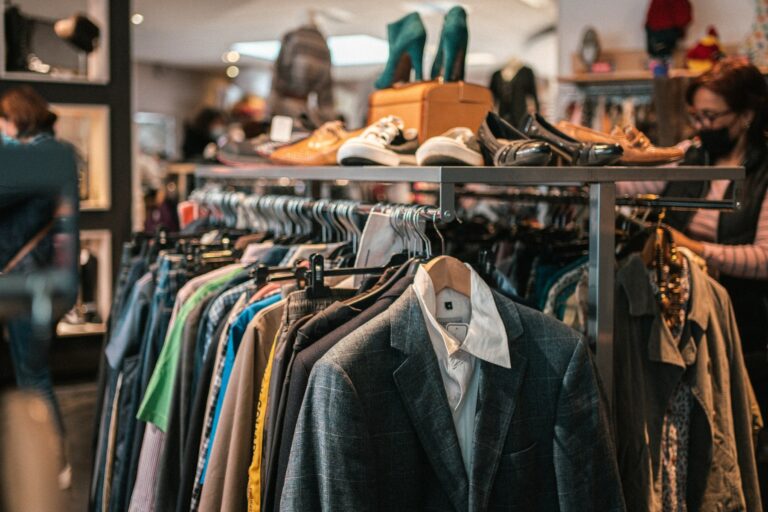 Ethical fashion Zurich clothing rack with shoes and curated second-hand pieces