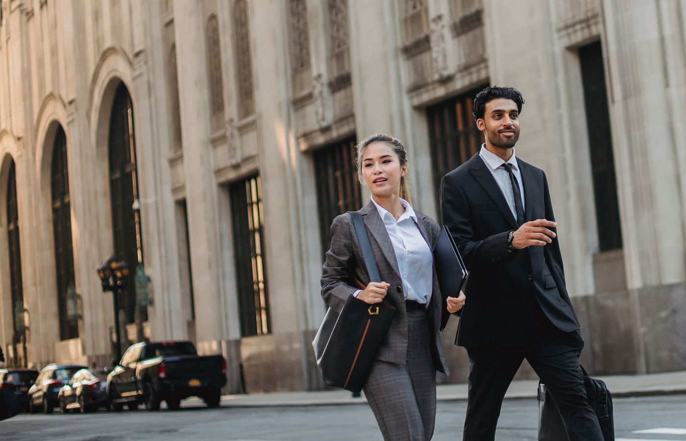 Business professionals in tailored suits showing smart business attire for Zurich finance style