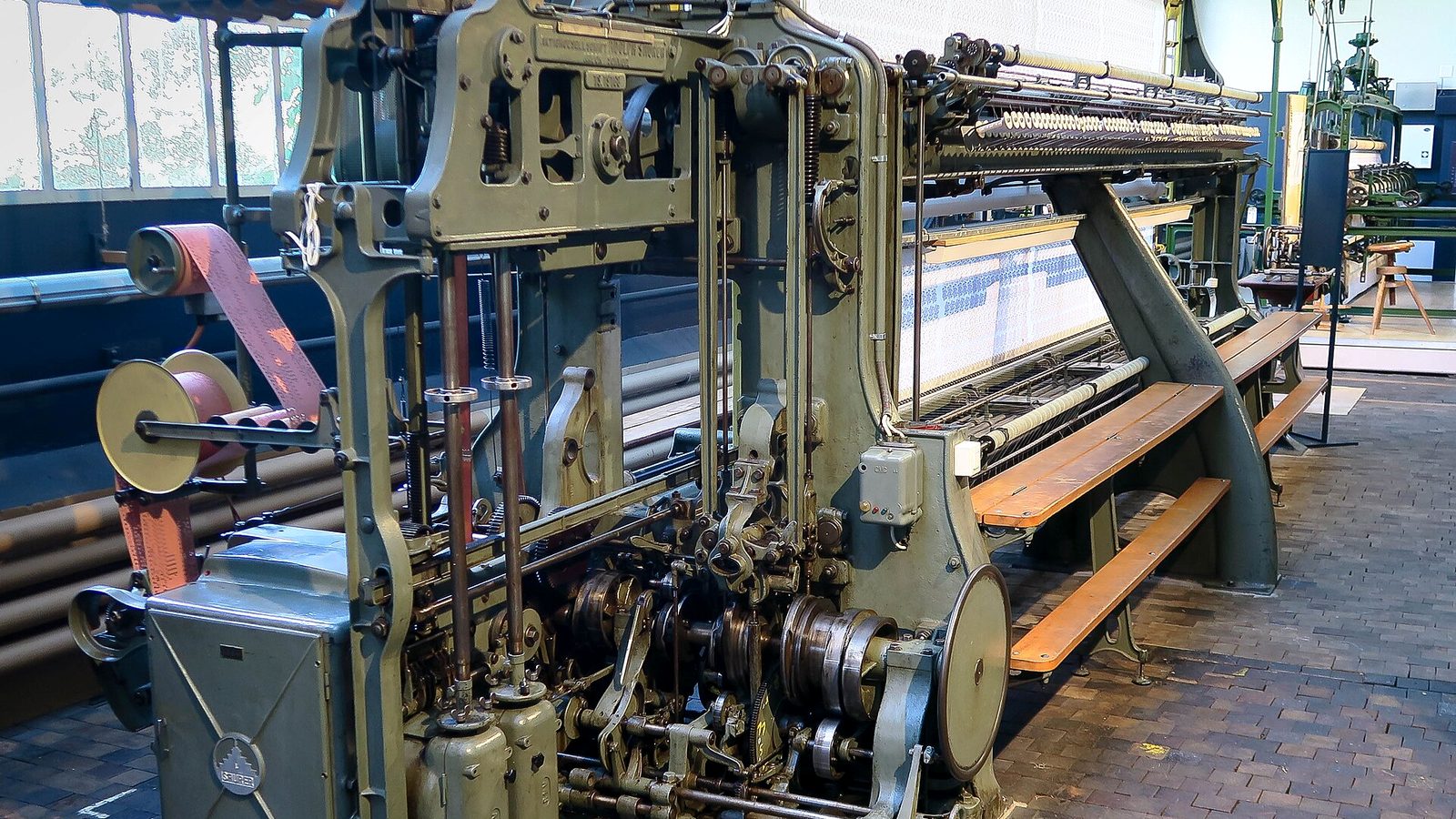 Modern automated schiffli embroidery machine by Saurer continuing the St. Gallen tradition