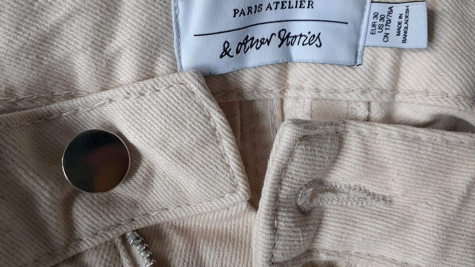 Sewn garment label close-up, where the country of origin of clothing is declared
