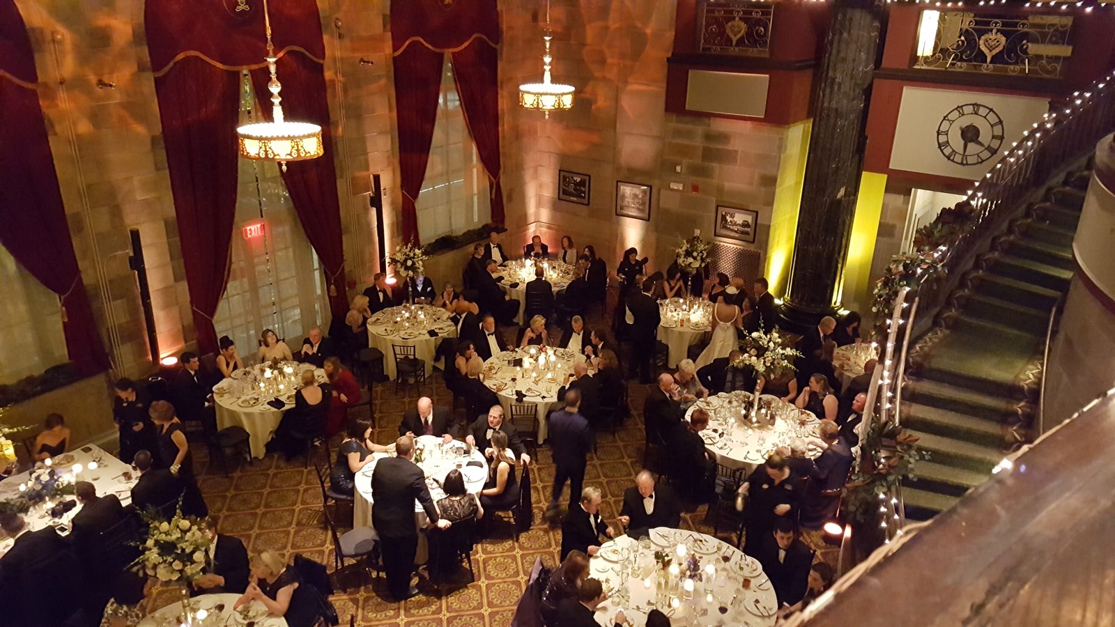Formal evening wedding reception with dressed tables awaiting guests